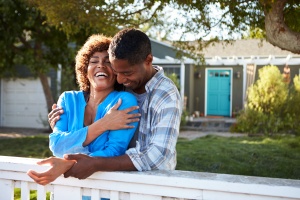 couple outside their home happy they know medicare 101