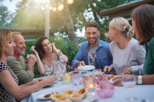 friend out to dinner talking about medicare enrollment