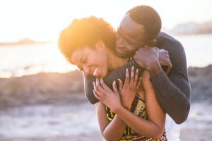 a happy couple at sunset talking about Medicare Supplement Plans