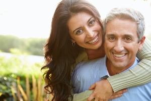 a couple smiling together once they done preparing for medicare